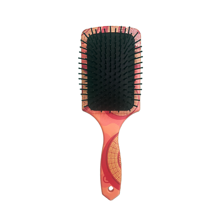 African Zulu print hair brush with beadwork-inspired pattern and bright color design.